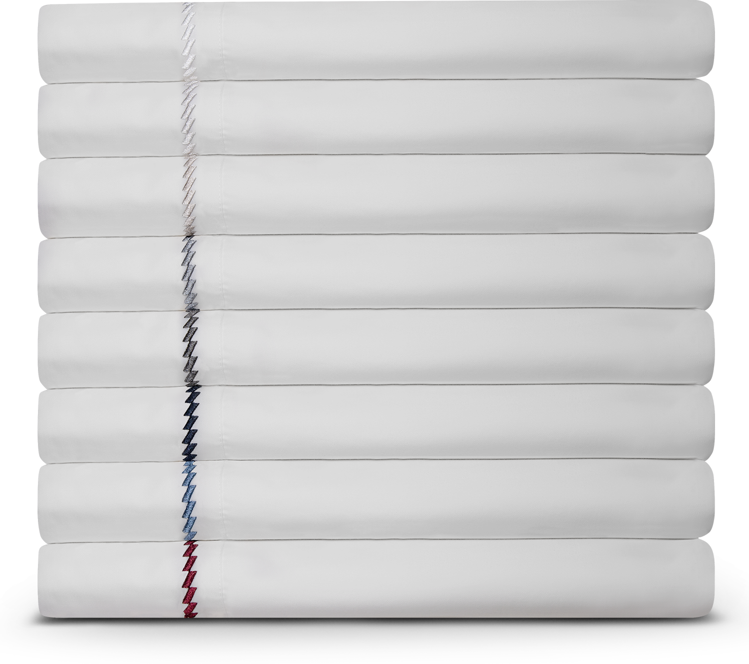 Stack of white sheets with various embroidery patterns