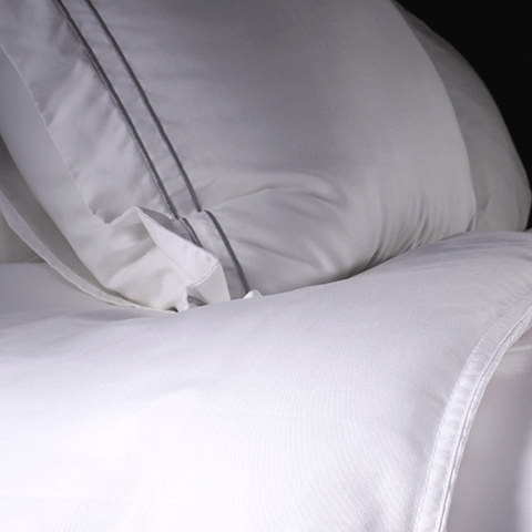 Sand colored lumbar pillow with white duvet cover
